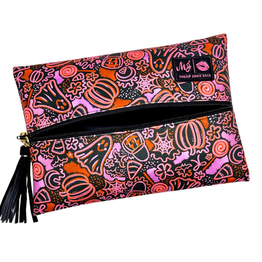 Colorful Halloween-themed pouch with a zipper and tassel on a white background