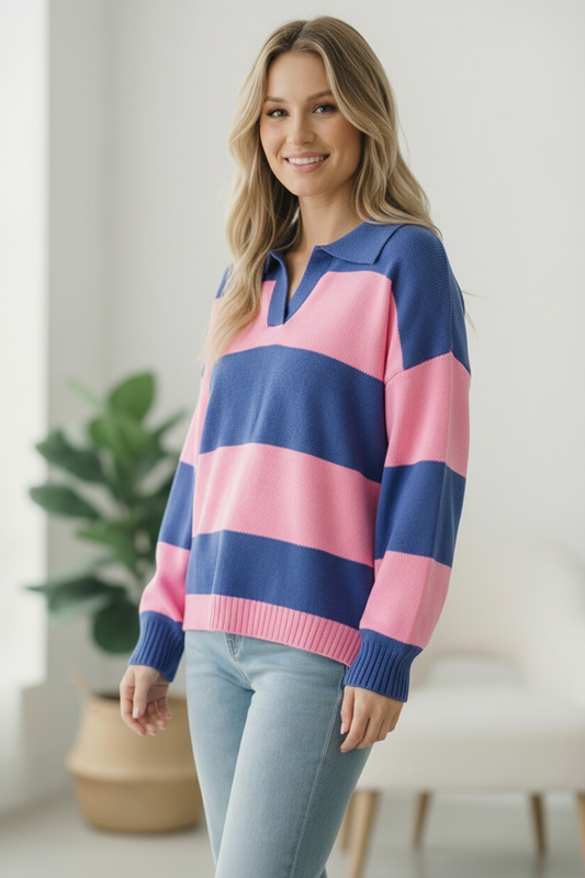 Woman wearing a pink and blue striped sweater indoors