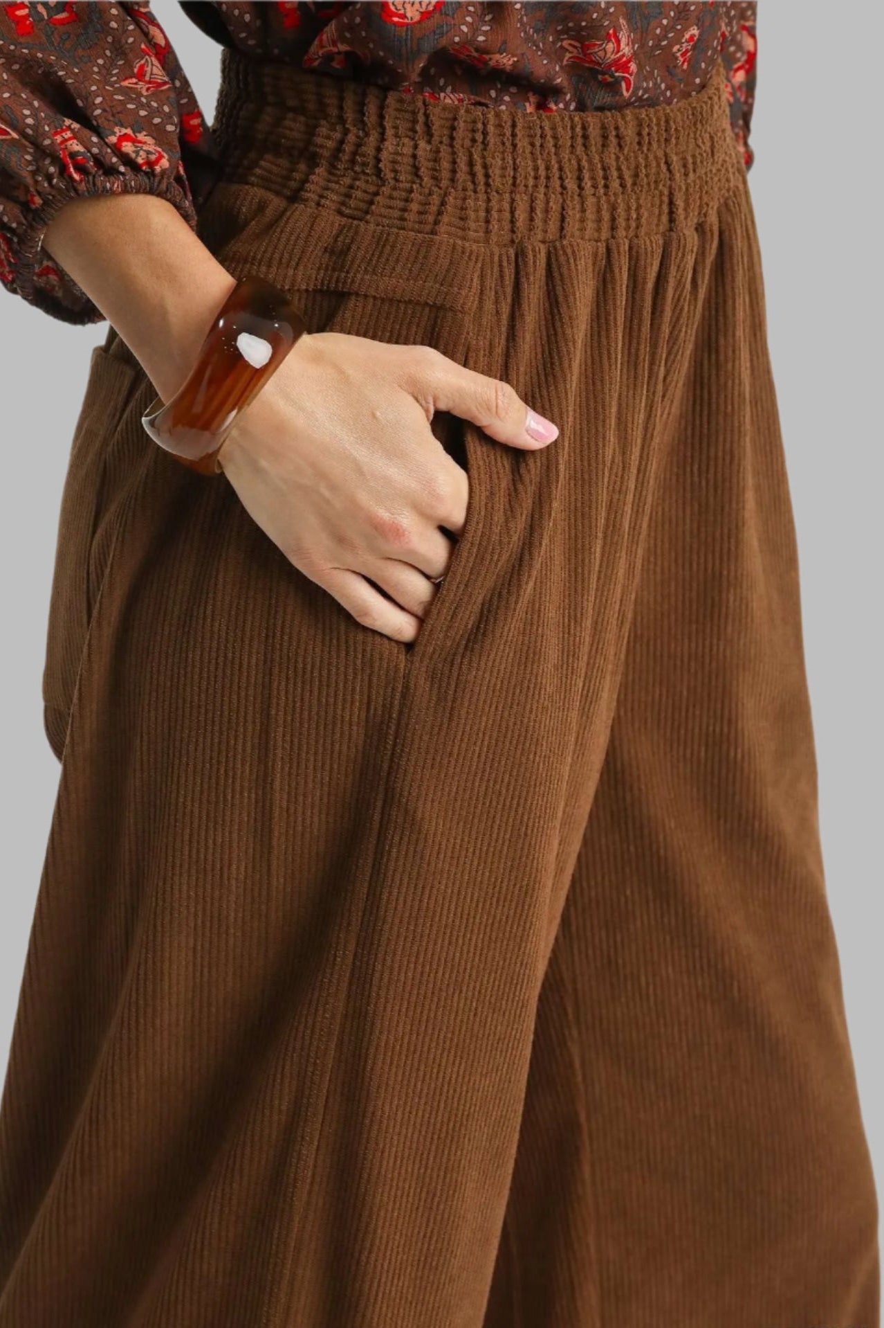 Brown corduroy pants with elastic waistband and pockets