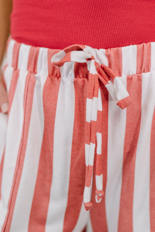 Red top and white and red striped pants with a tie waist.
