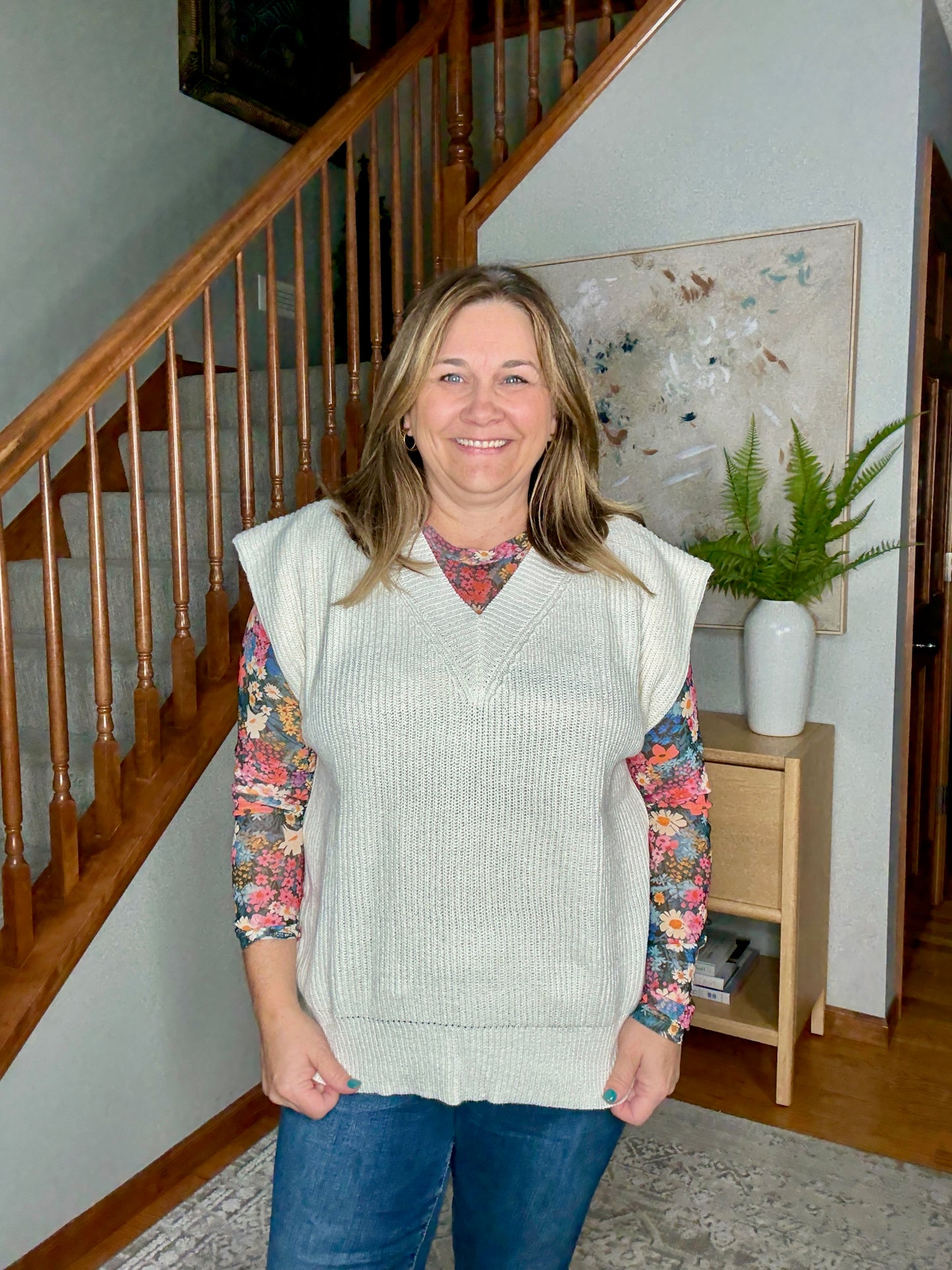 Vneck sweater vest with floral mesh top underneath