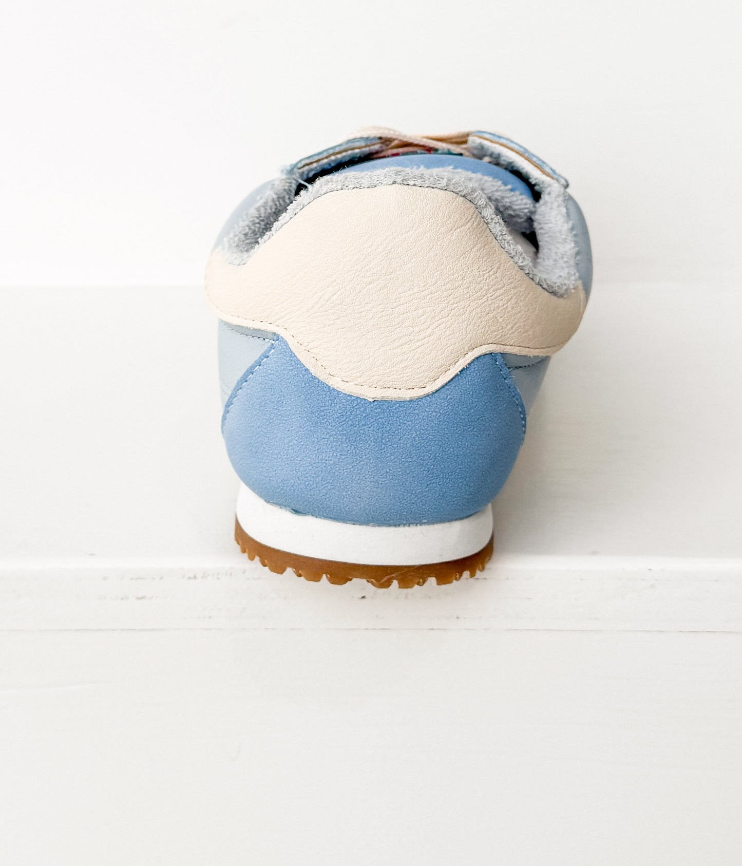 Blue and white sneaker on a white background