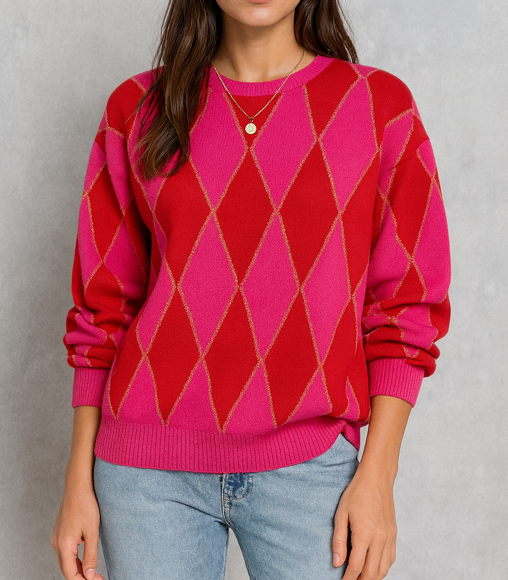 Person wearing a pink and red argyle sweater against a gray background