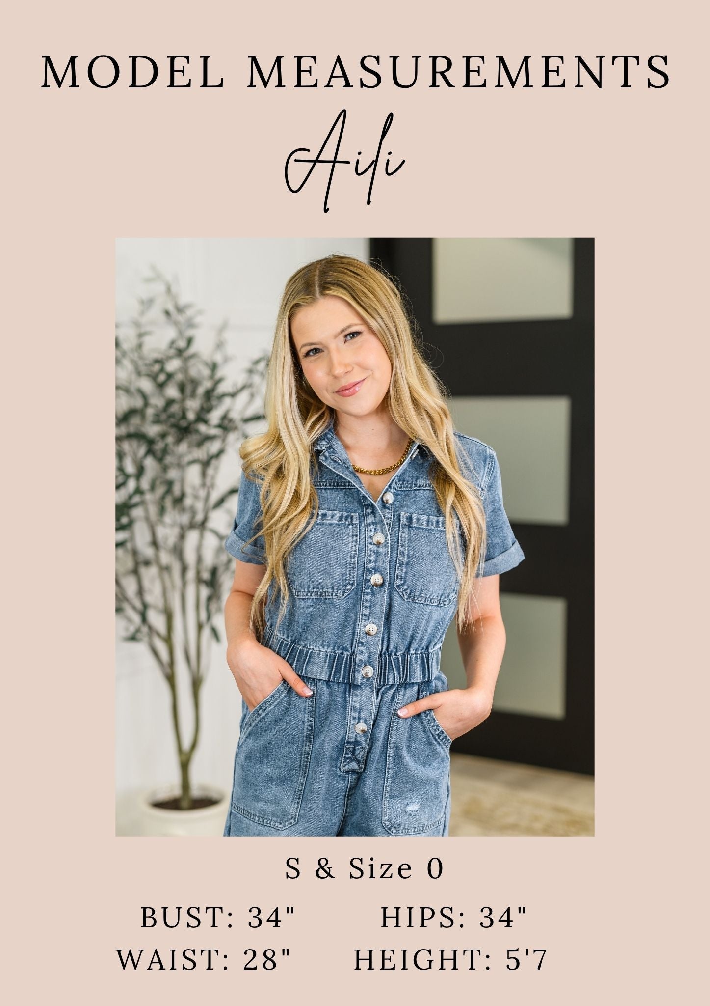 Woman wearing a denim jumpsuit with model measurements displayed.