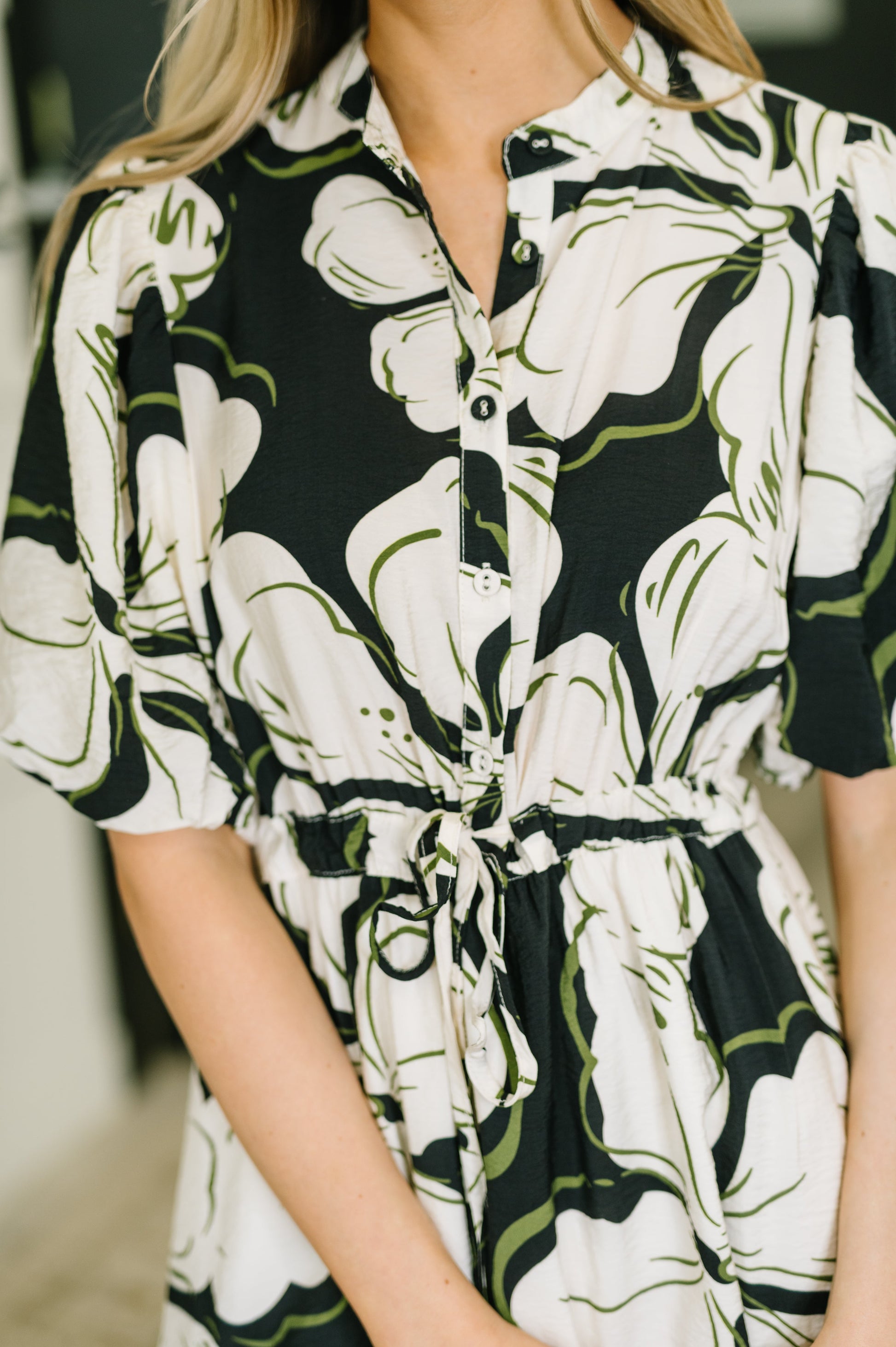 Woman wearing a floral dress with a blurred background