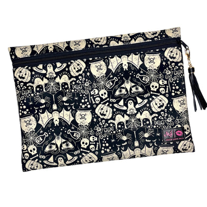 Pouch with Halloween-themed design featuring ghosts, pumpkins, and bats on a black background.