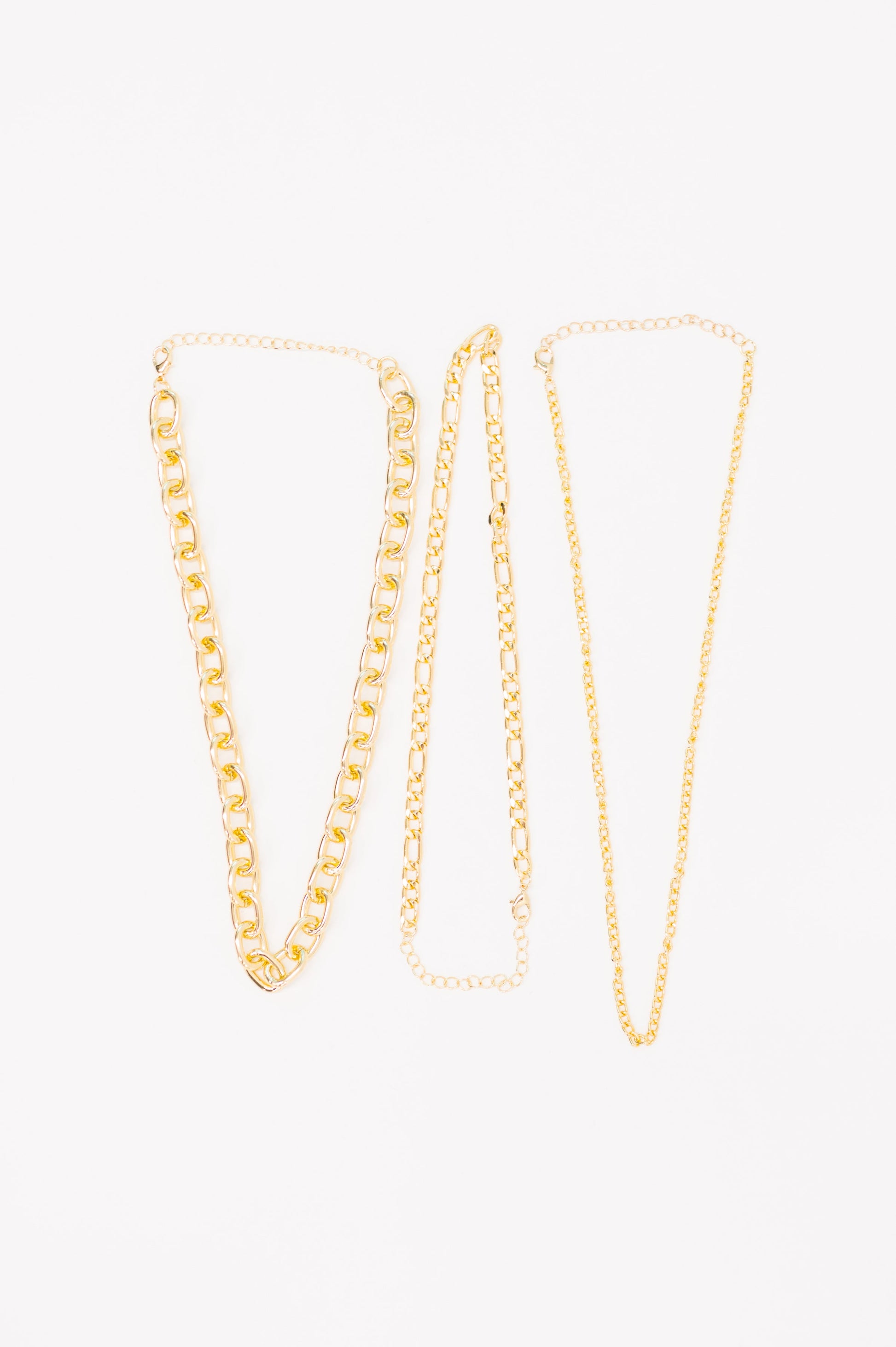 Two gold chain necklaces on a white background