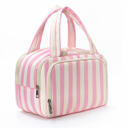 Pink and white striped bag with handles on a white background