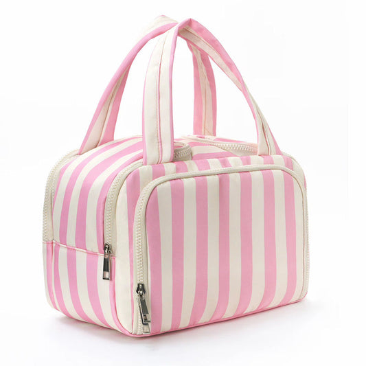 Pink and white striped bag with handles on a white background
