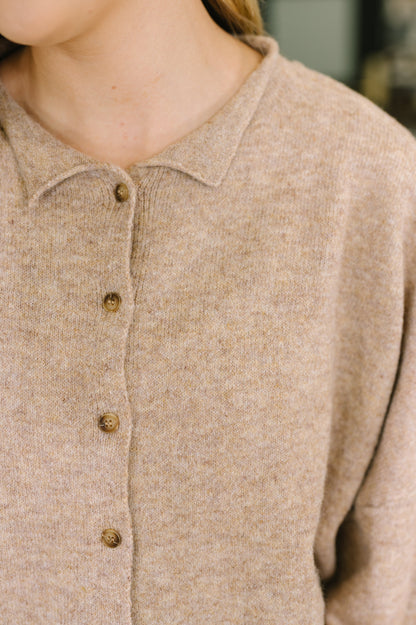 close up of brown button up cardigan