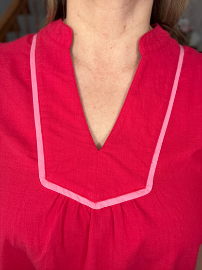 Close-up of a red garment with a deep neckline