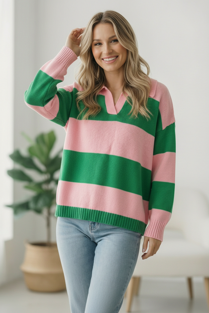Woman wearing a green and pink striped sweater indoors