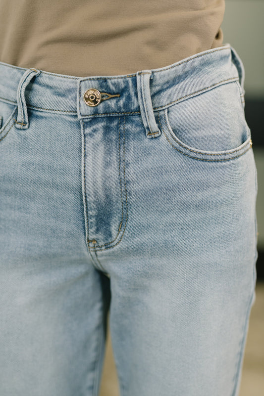 Close-up of light blue jeans with a blurred background