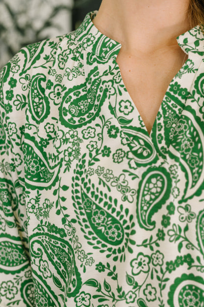Green paisley pattern on a white shirt