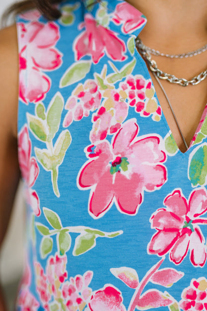 Close-up of a blue dress with pink floral pattern