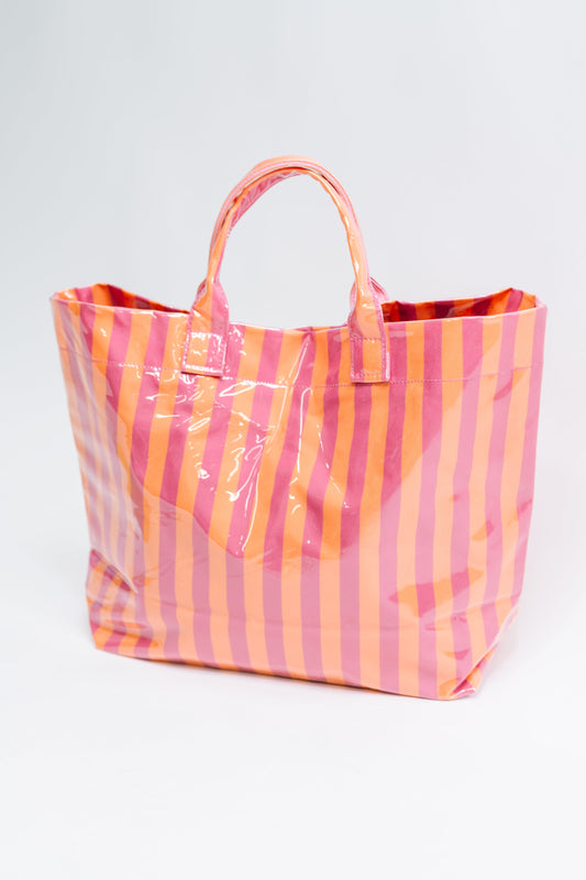 Striped tote bag with pink and orange pattern on a white background