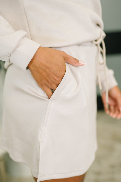 Person wearing a white outfit with a blurred background