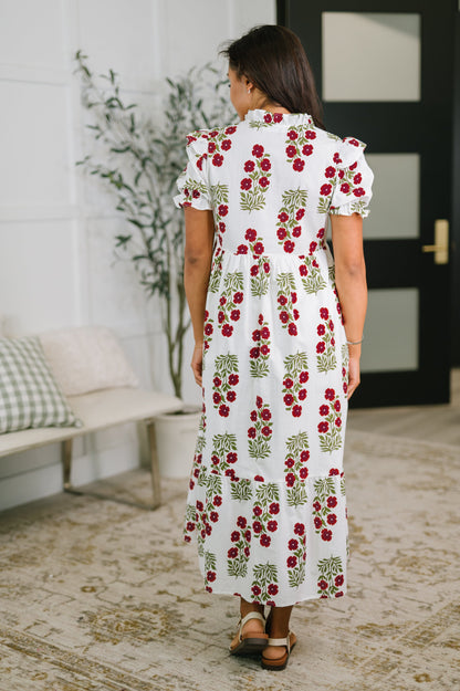 Woman wearing a floral dress in a home setting