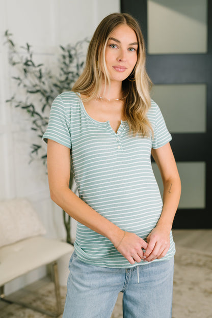 Woman wearing a striped shirt and jeans indoors