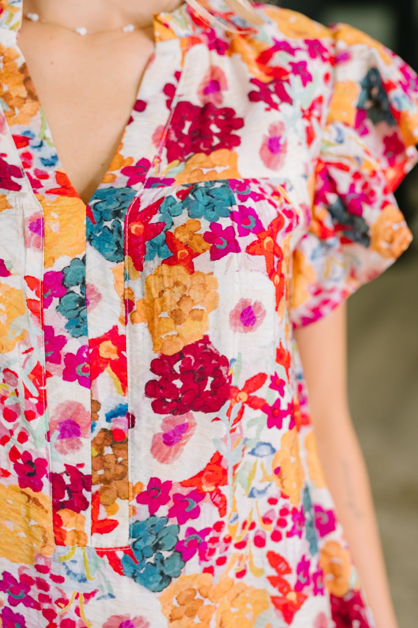 Colorful floral dress with a blurred background