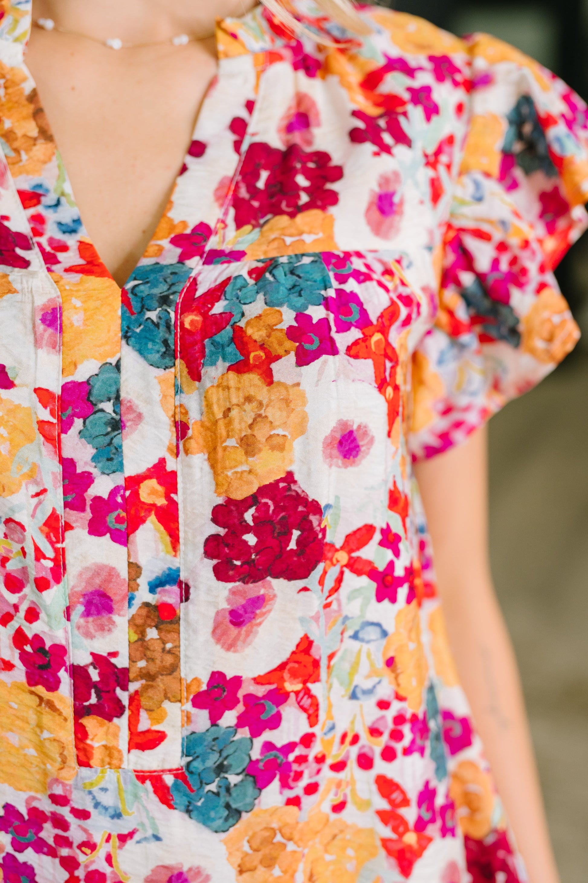 Colorful floral dress with a blurred background