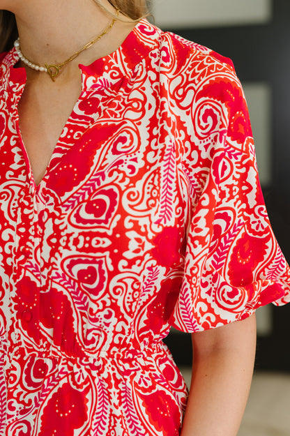 Red and white patterned dress worn by a person