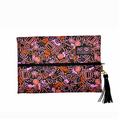 Halloween-themed clutch bag with colorful designs on a white background