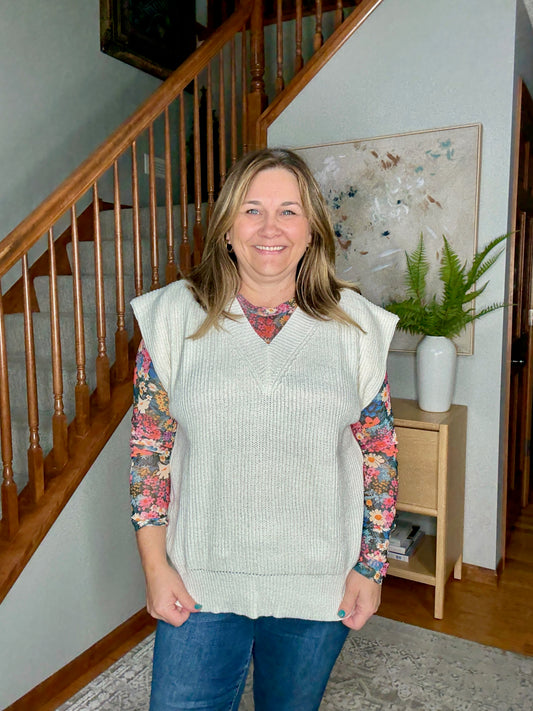Vneck sweater vest with floral mesh top underneath
