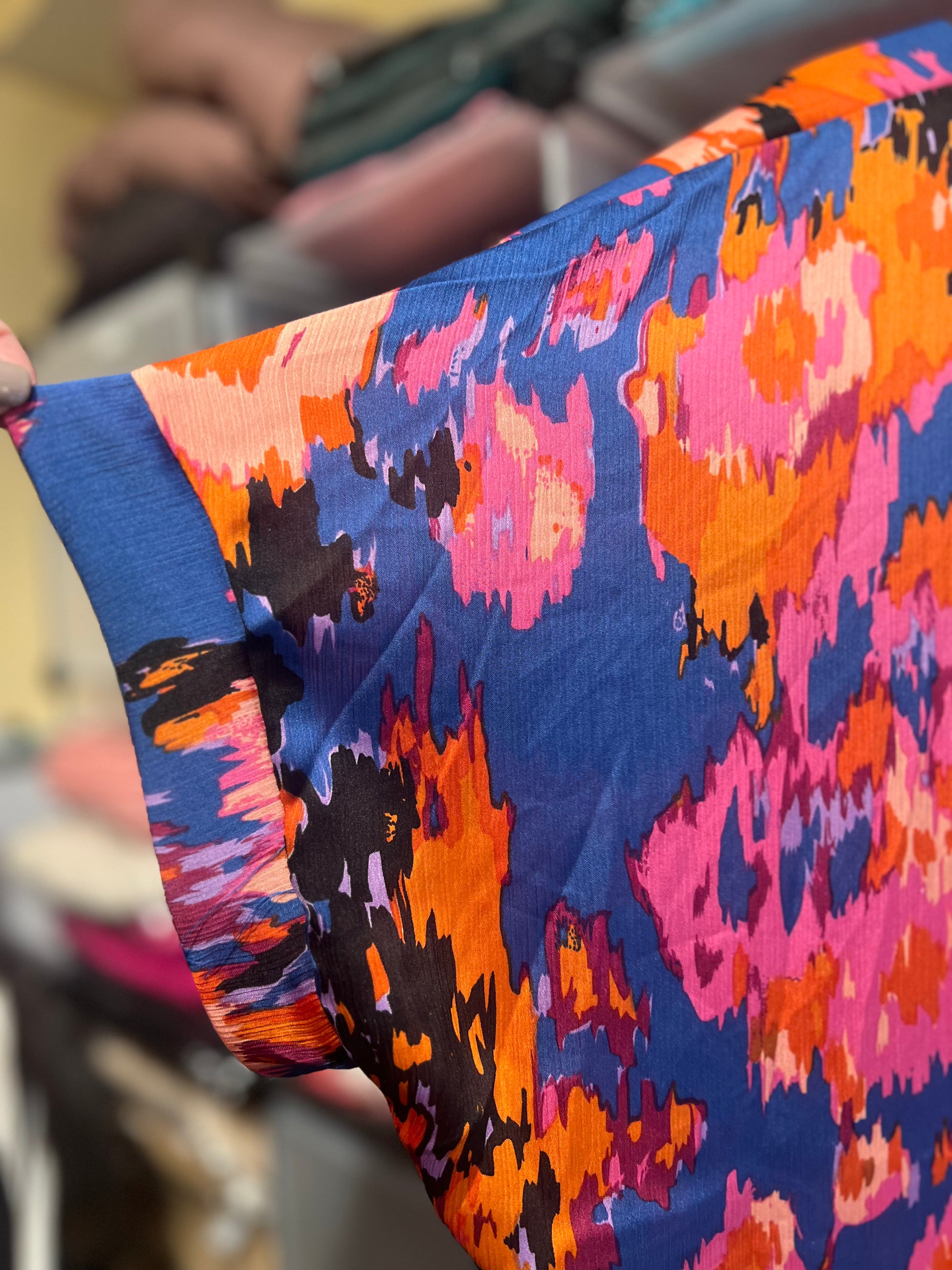 Close-up of colorful fabric with abstract pattern, blurred background