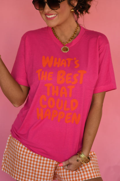 Person wearing a pink t-shirt with text and checkered shorts against a pink background