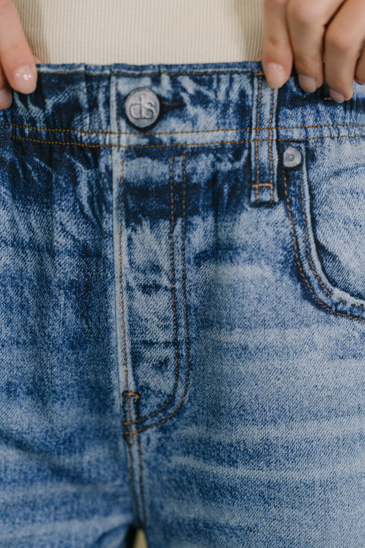 Close-up of blue denim jeans with a button and zipper