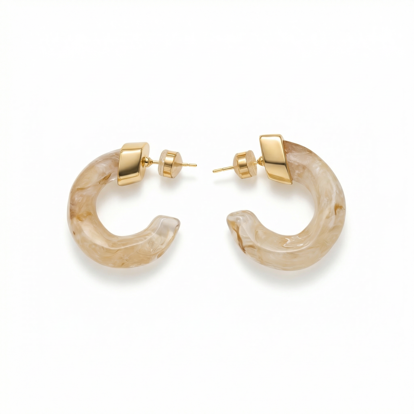 Pair of gold hoop earrings with beige stone-like material on a white background