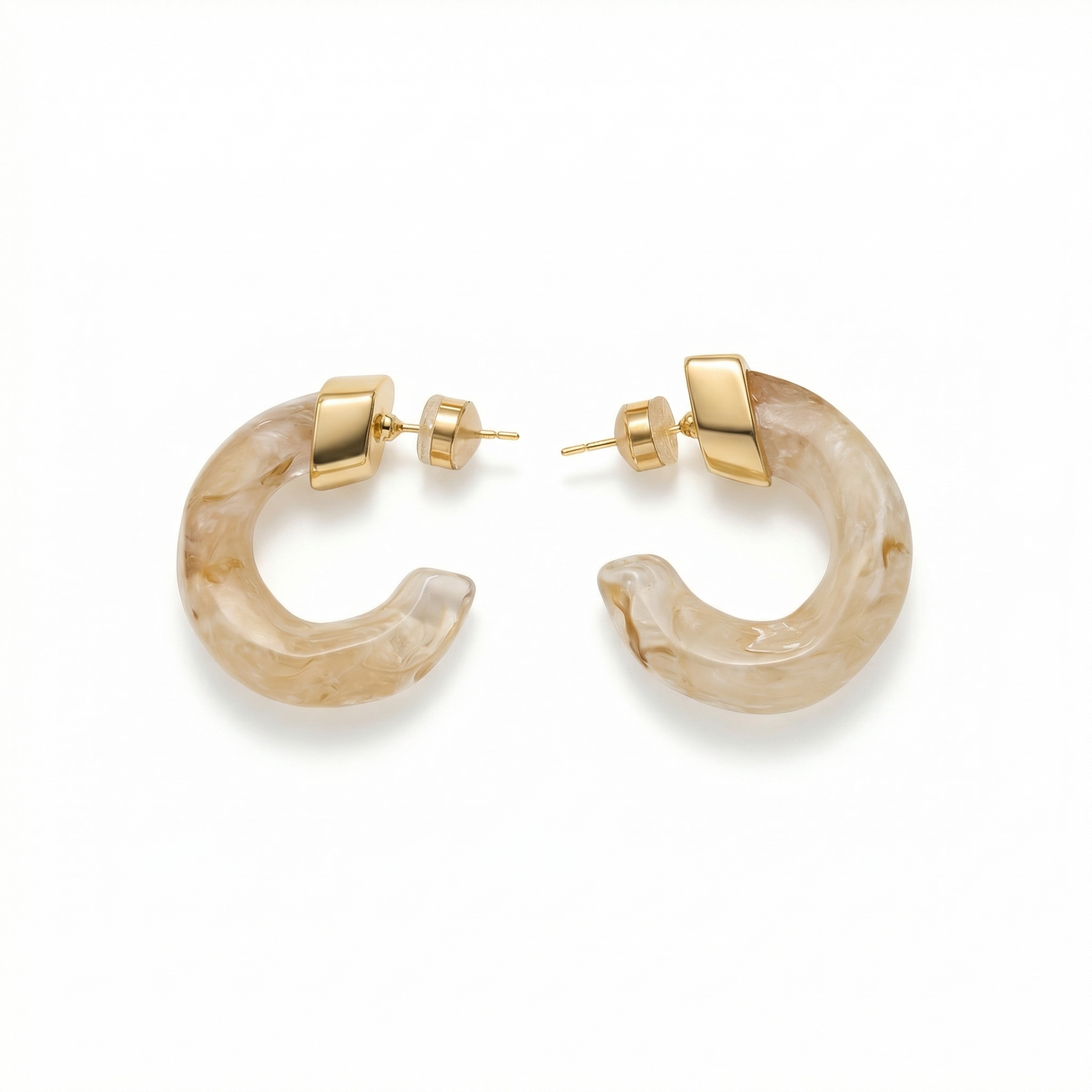 Pair of gold hoop earrings with beige stone-like material on a white background