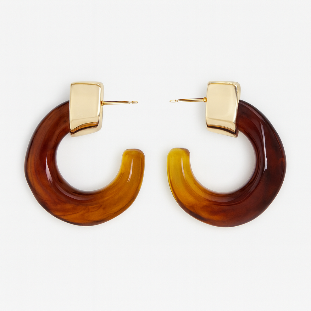 Pair of brown hoop earrings with gold accents on a white background