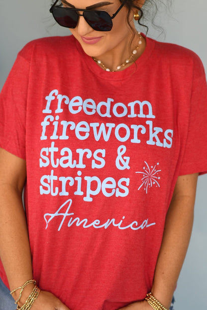 Person wearing a red t-shirt with patriotic text and graphics.
