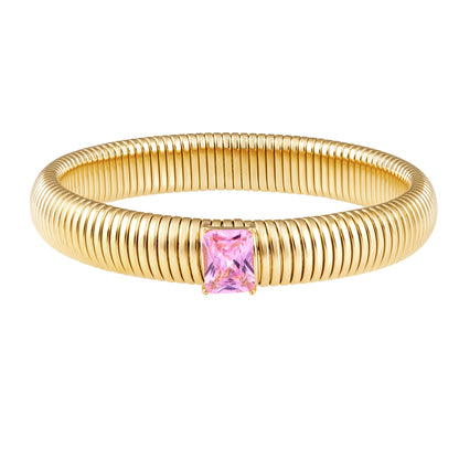 Gold bracelet with a pink gemstone on a white background