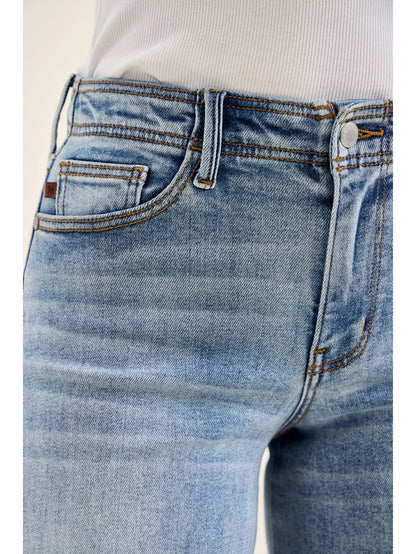 Close-up of blue jeans with a white background