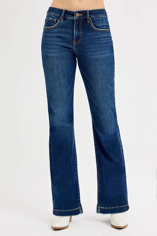 Mid Rise Flare Blue jeans by Risen on a white background