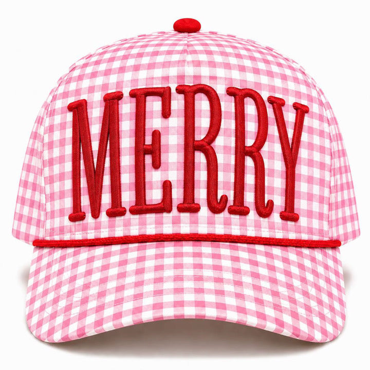 A pink and white gingham baseball cap featuring the word 'MERRY' embroidered in red across the front, with a red button on top and a red stitched trim on the brim.