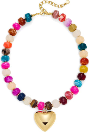 Colorful beaded necklace with a gold heart charm on a white background