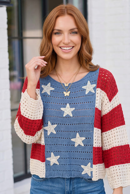 Woman wearing a colorful star-patterned sweater with a blurred background