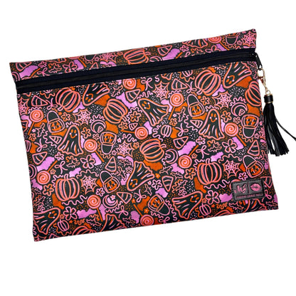 Pouch with Halloween-themed design featuring pumpkins, ghosts, and other elements on a black background.