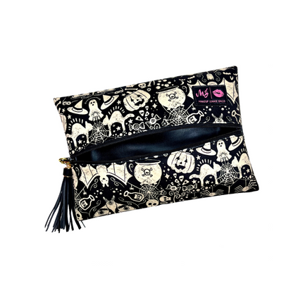 Makeup bag with Halloween-themed design on a white background