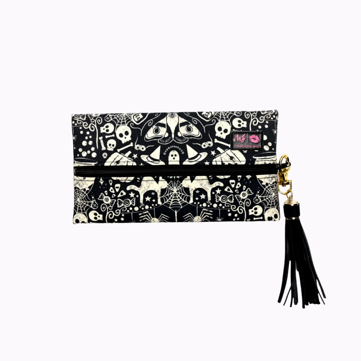 Black and white patterned pouch with tassel on a white background